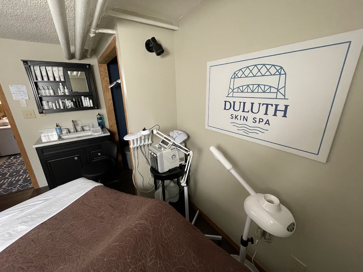 Treatment room at Duluth Skin Spa with spa bed, sink, and professional equipment